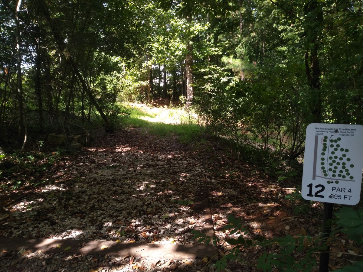 a long tight fairway, curving to the right.
