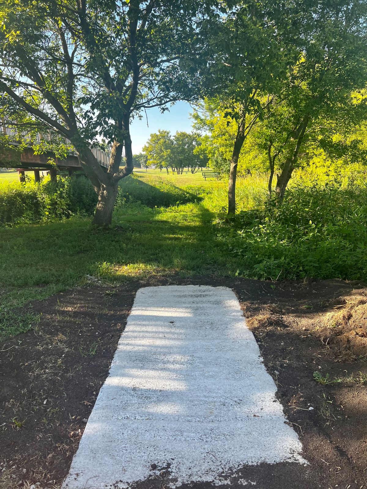 Hole 9 tee pad looking over river.