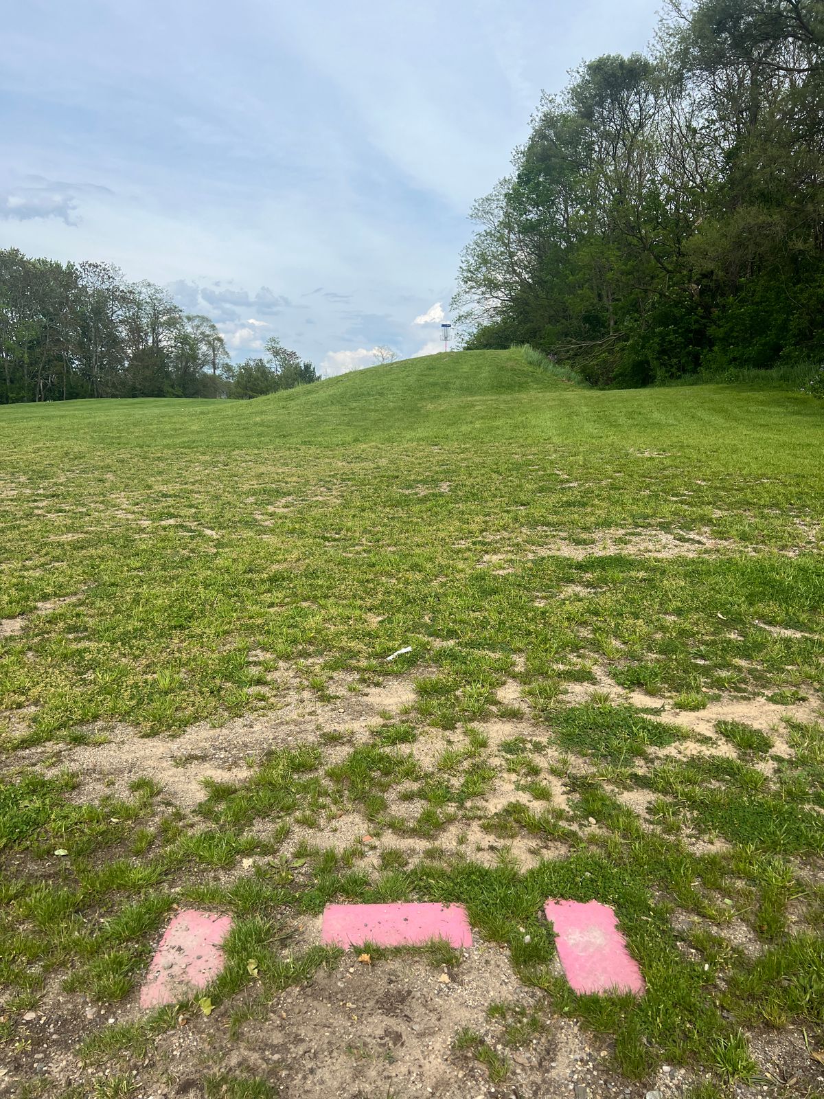 Hole 1 Tee Pad - Going to basket on top of the hill (careful, not pick drop off on the other side)