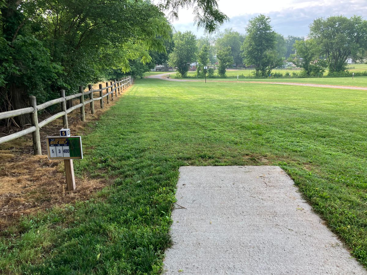 Hole 5 400’. Over the fence on the left is OB. Creek is OB. Gaurdians about 50’ from the basket.