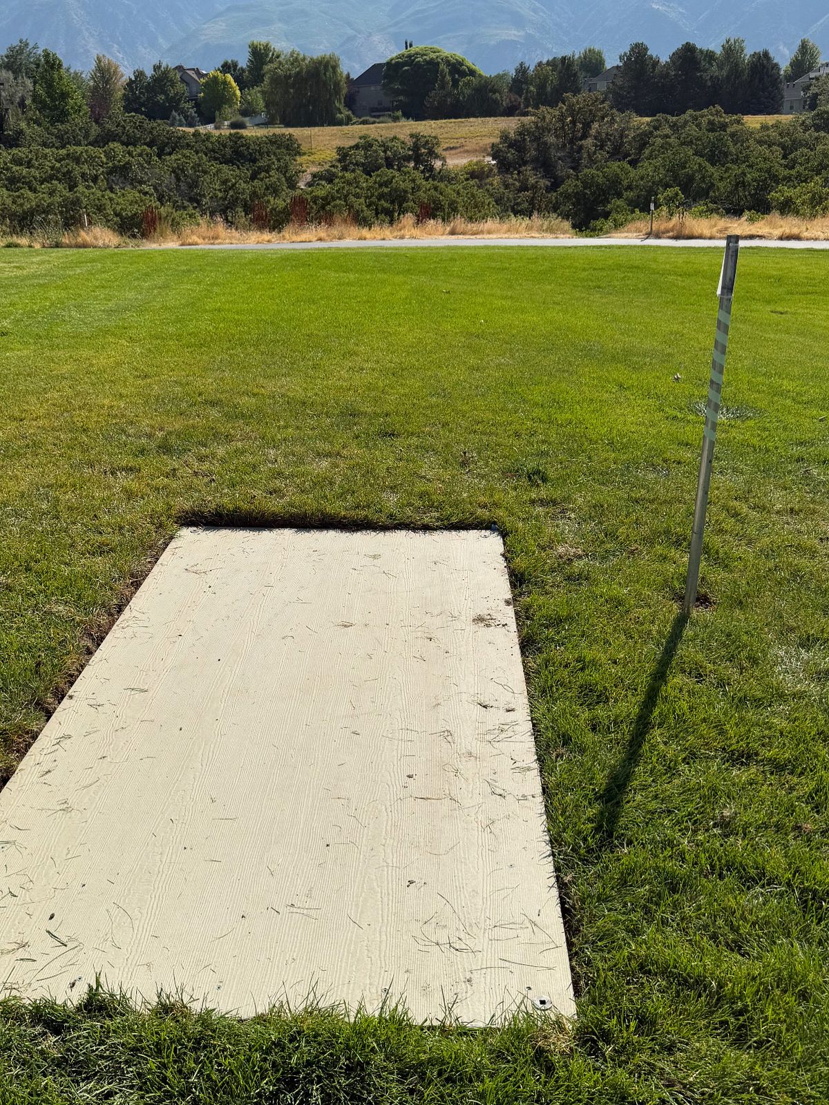 Hole 11 - new concrete fiber pad instead of having to throw from grass