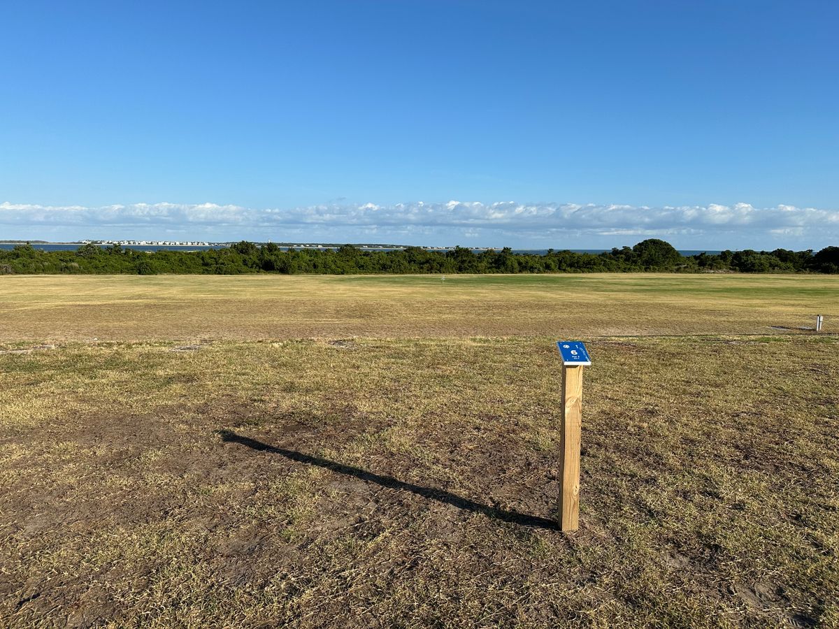 Hole 6 tee. (Climb fort structure right of Hole 5’s tee.  Elevated.  Avoid drop off fort wall.)