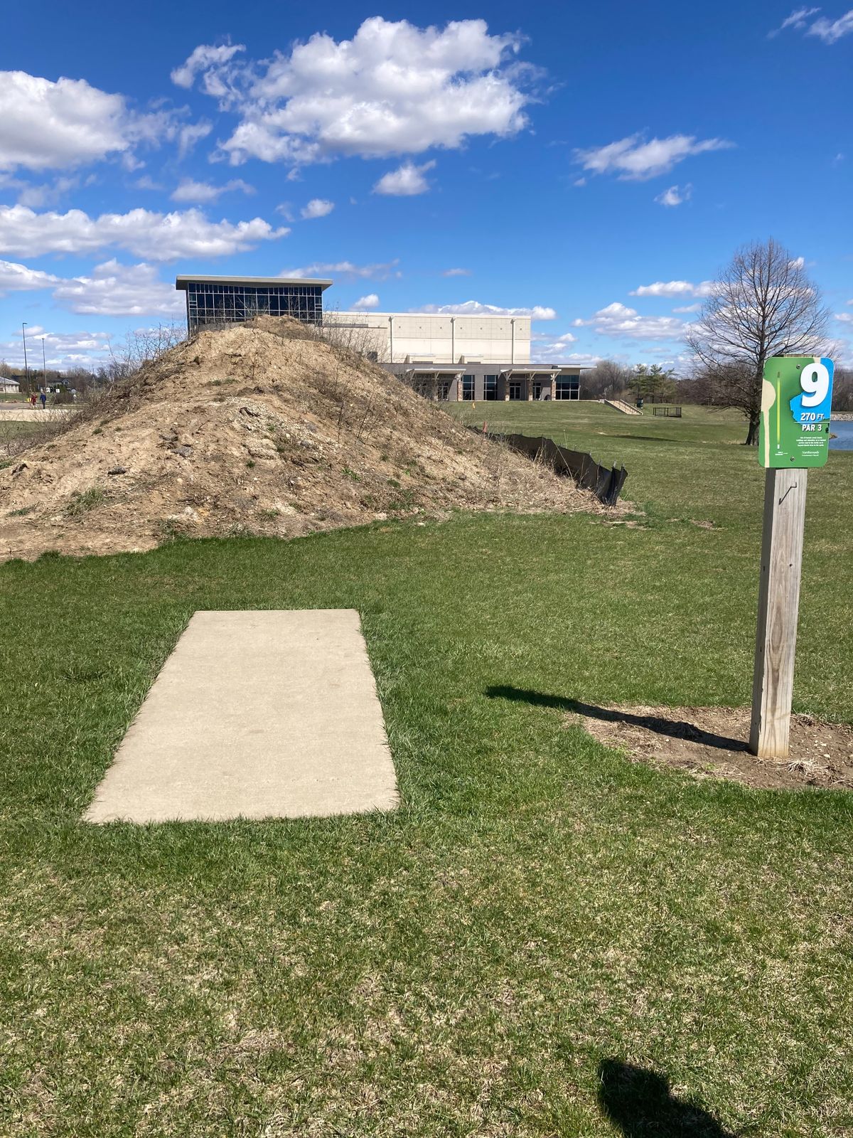 There is a mound of dirt on amateur hole 9.