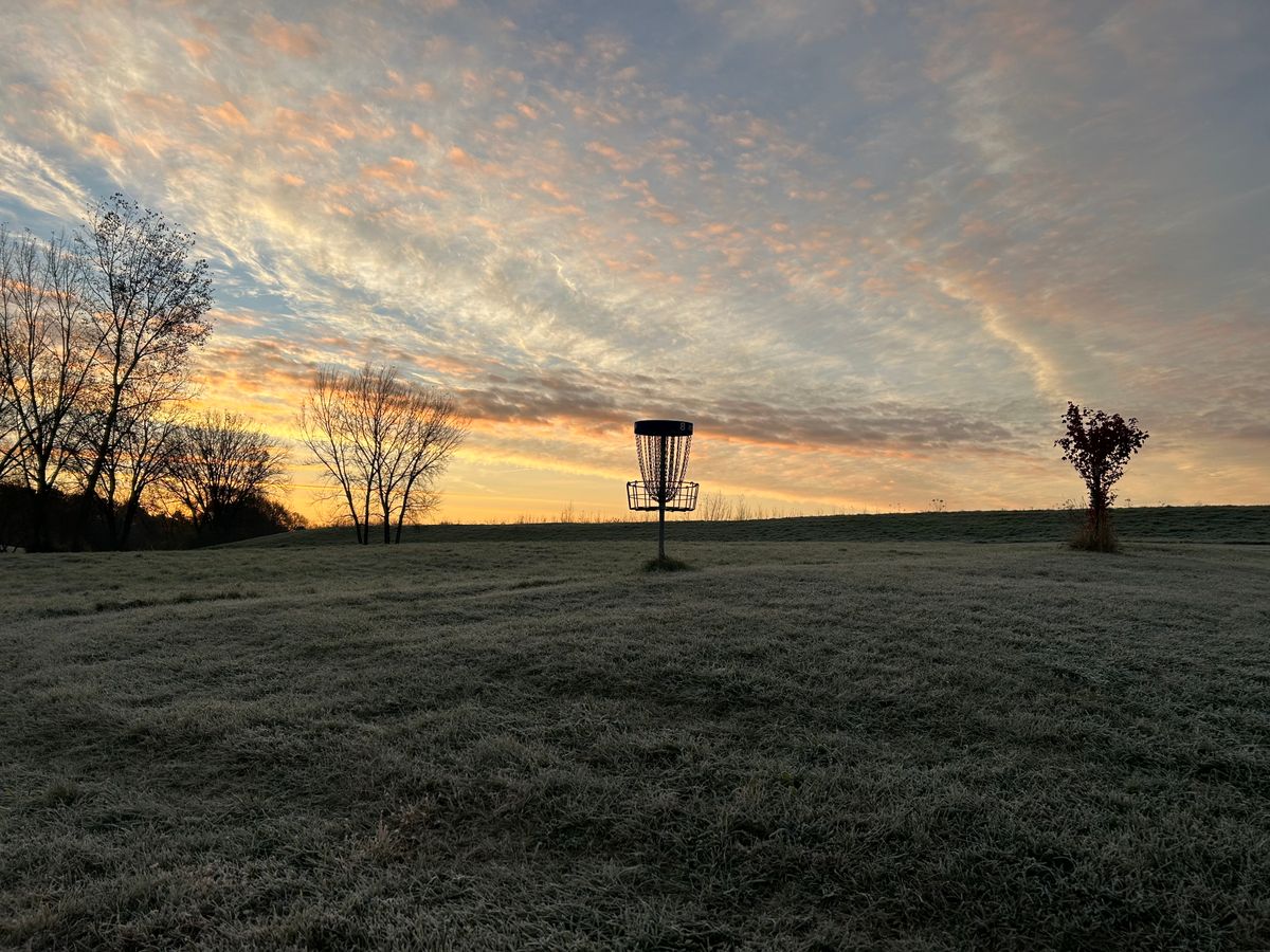 Hole 8 basket with nice sunrise