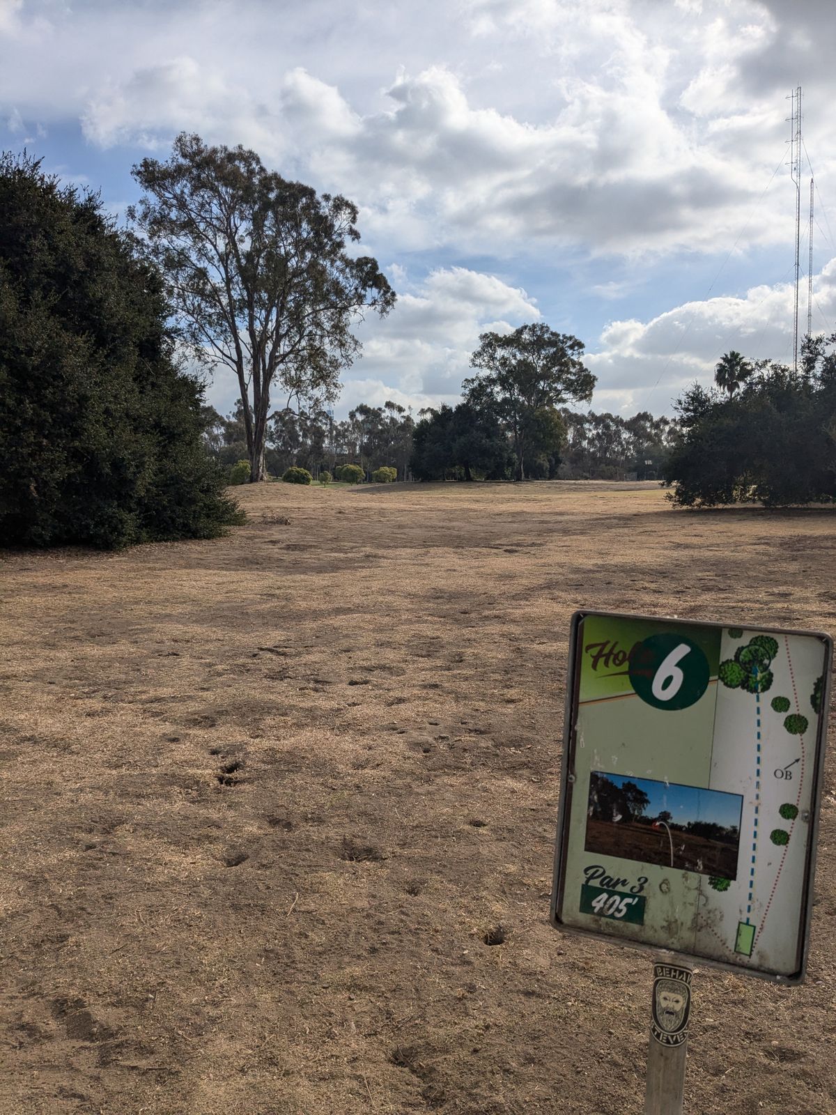 Hole #6, the foreground tree dead center has the basket location just past it. If you can fade your disc past its location and right you'll be setup well.