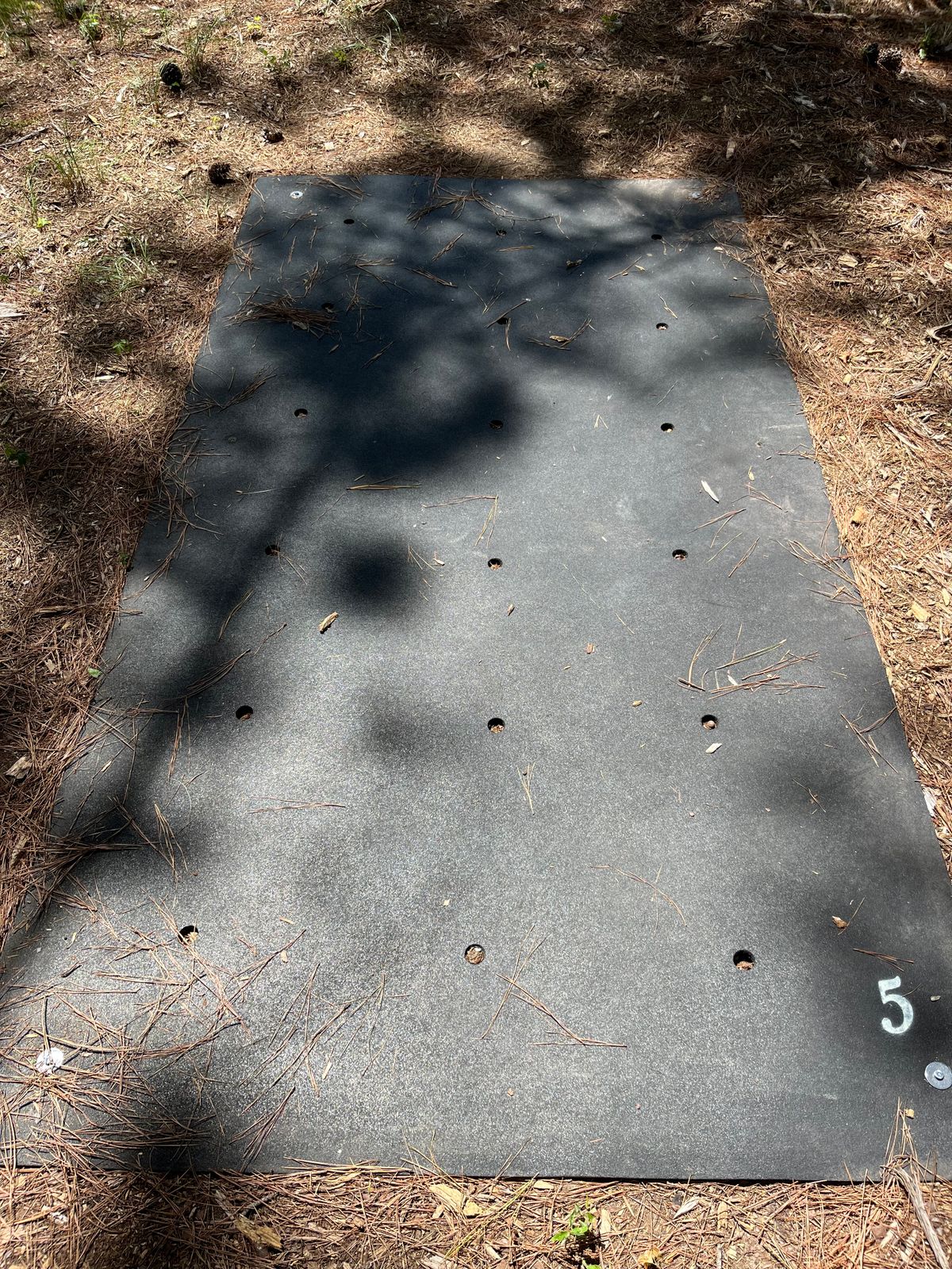 Hole number indicated on right rear of mat.