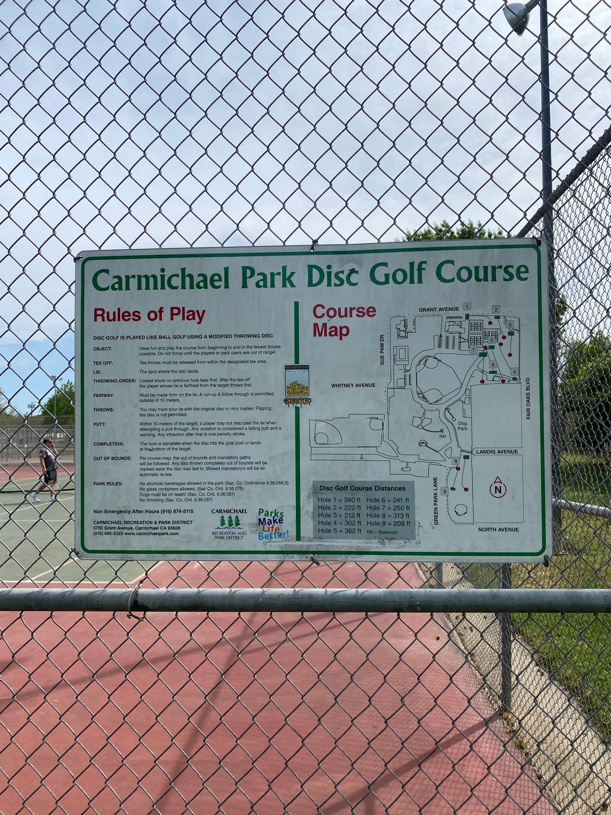 Course map on tennis court fence