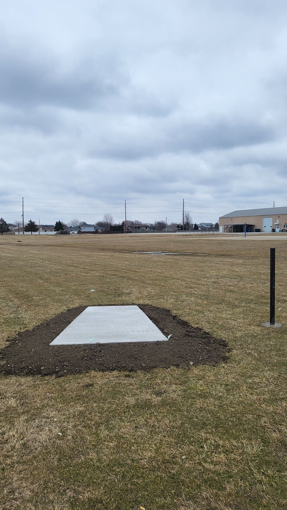 Concrete pad. Hole 1. Pre basket/sign install