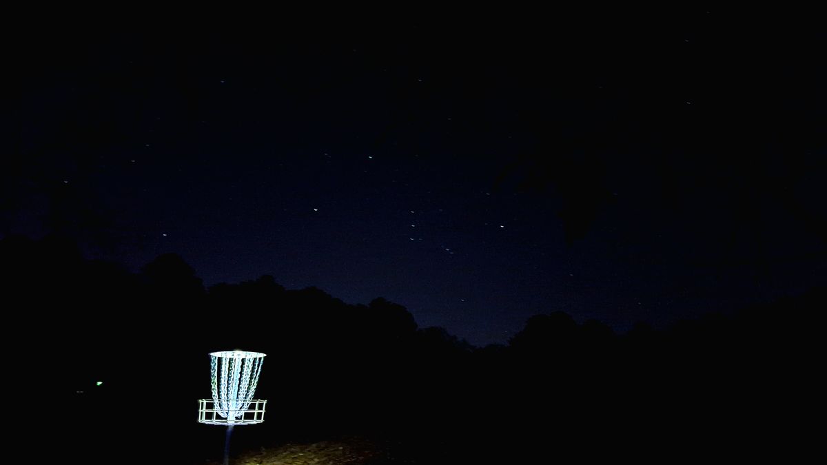 Orion rising over the treeline behind the pond on hole #5 at Friday Night Glow.