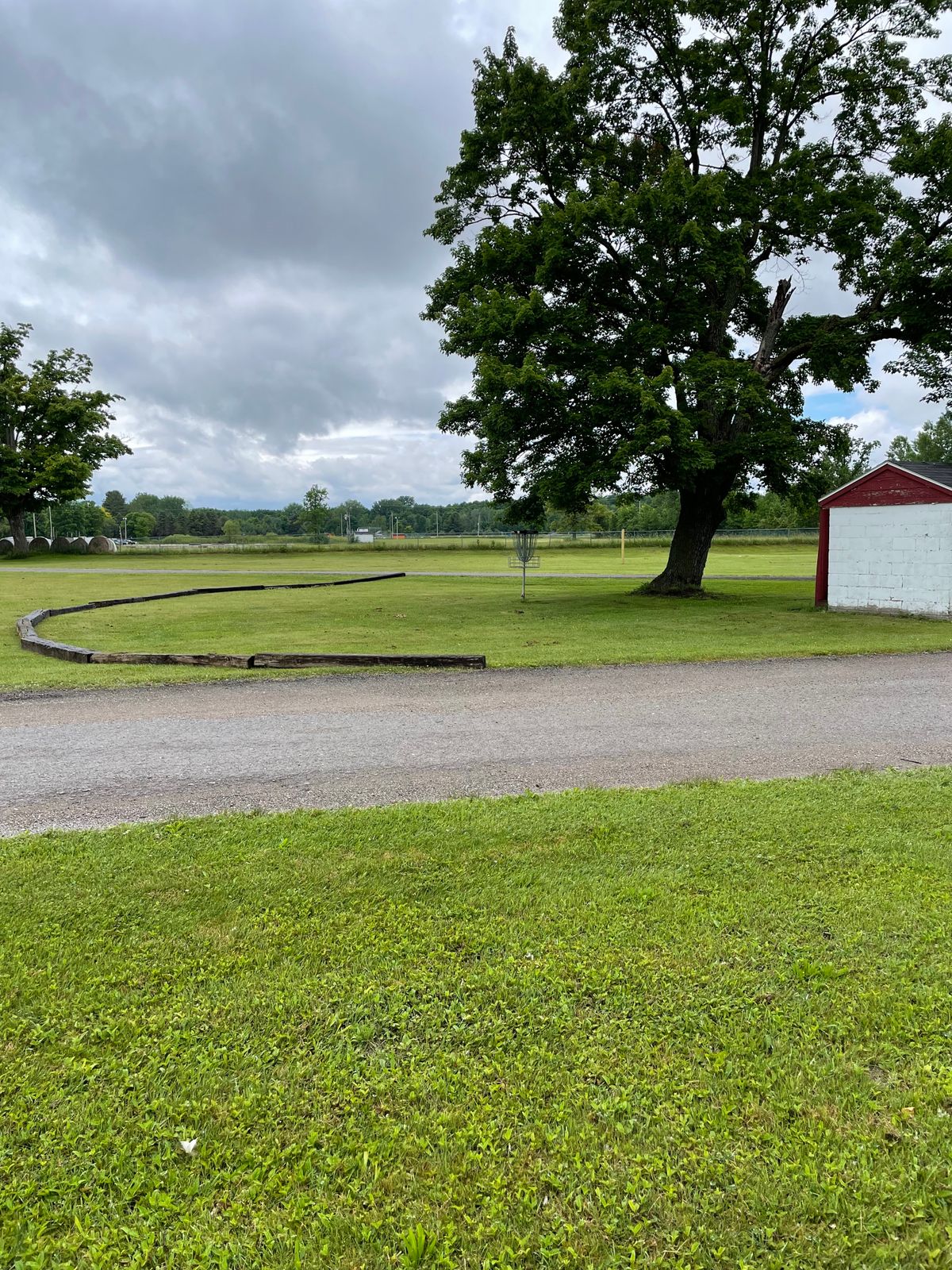 Hole 12: Railroad tie / dirt road island