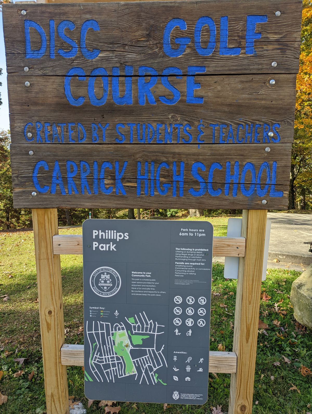 Park amenities & rules.  Unfortunately no disc return.  Though there's some room behind this sign to stash a disc or two.