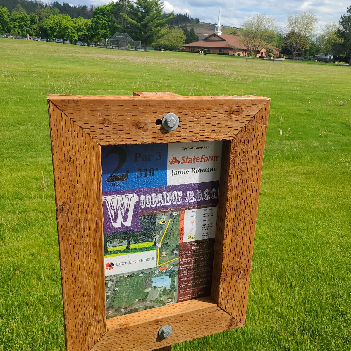 Distance and par on the hole 2 sign are incorrect.  Actual distance is 405 feet making this hole a par 4. 