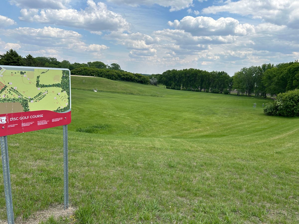 First tee. 380 feet, basket is just right of the sign