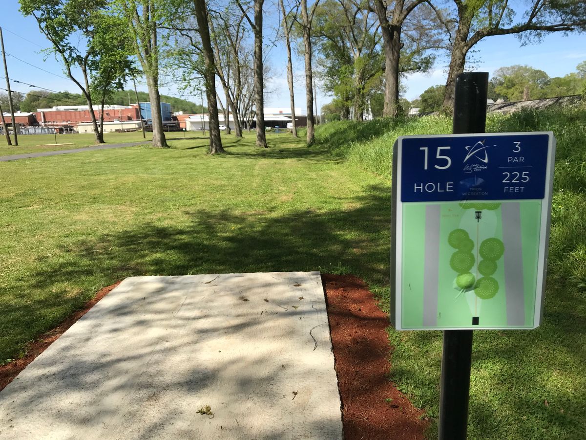 No. 15 tee box. Basket straight ahead behind trees.