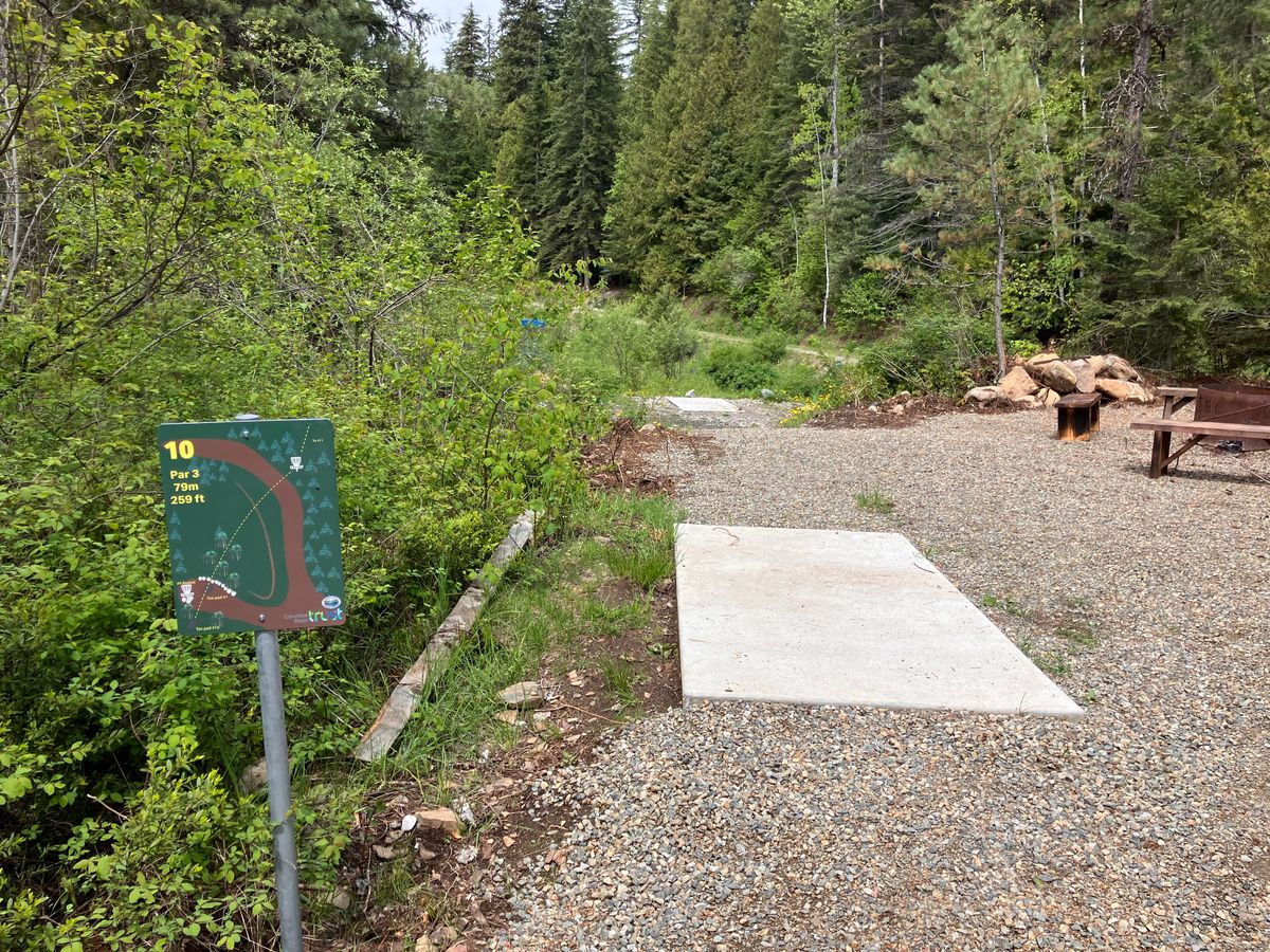 Tee pad and sign for hole 10 with tee pad  for hole one ahead