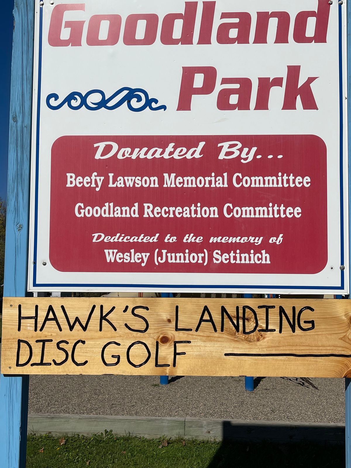 Arrow pointing to first basket and a dirt area to park towards main highway side road!!