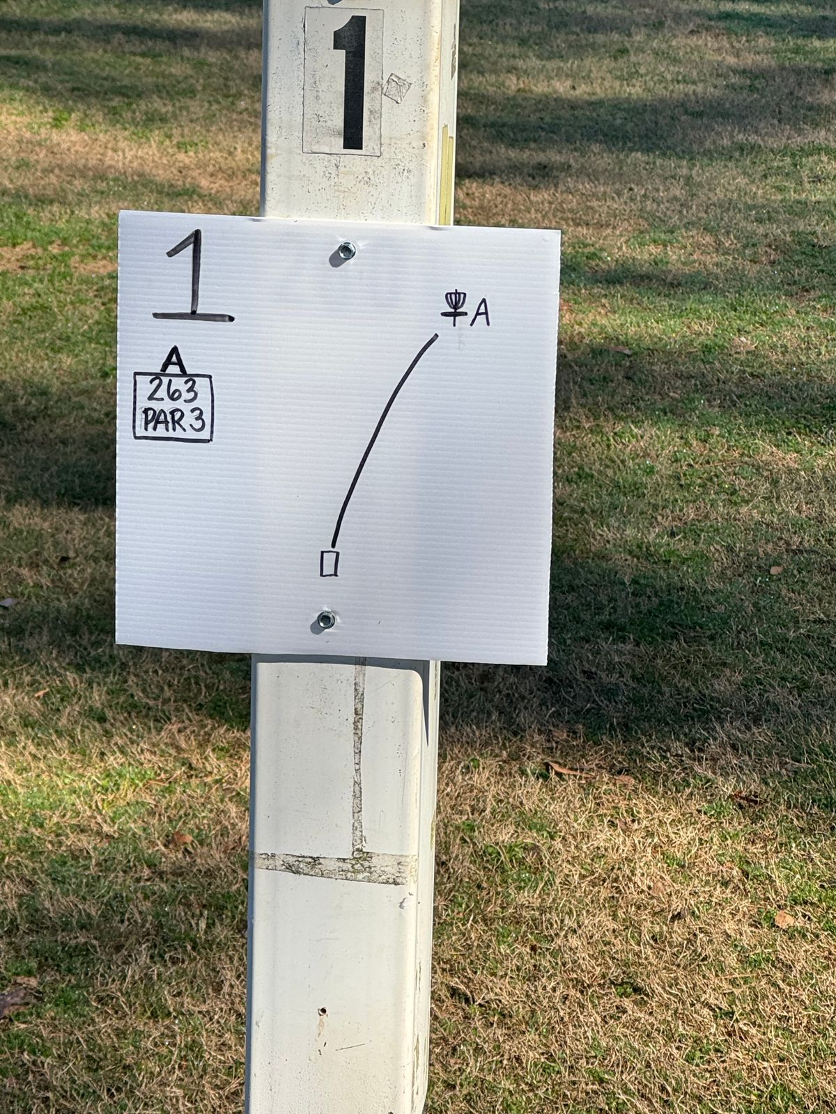 Simple rudimentary signage however they work. You can see most tee box from previous basket.