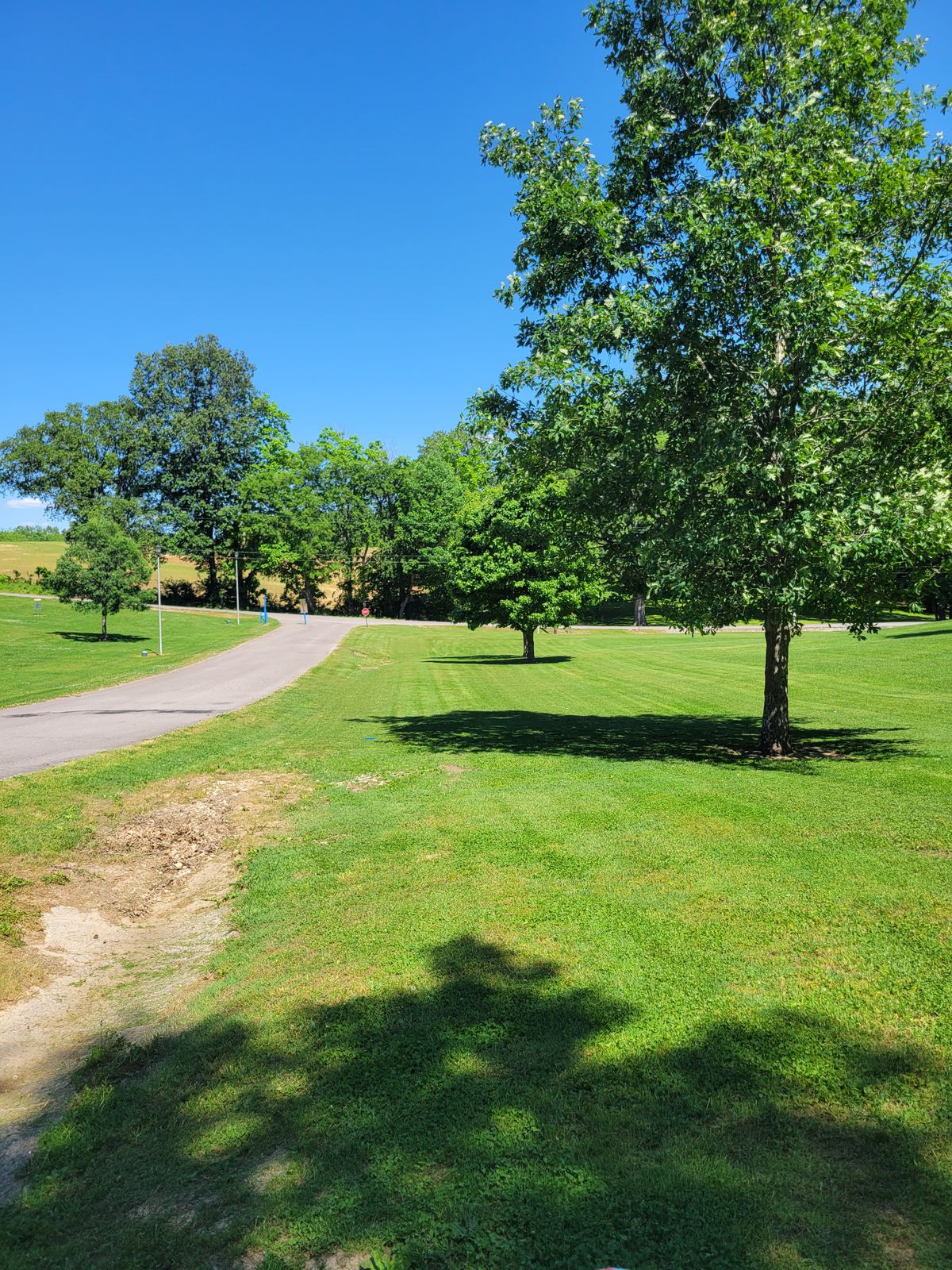 Hole 2 fairway, road left and long OB.
