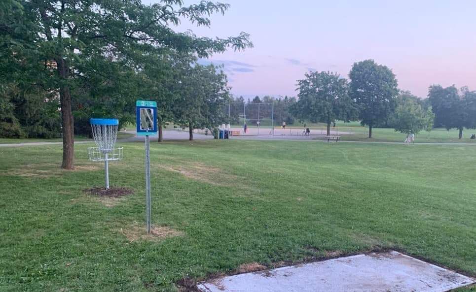 Hole 2 teepad with hole 9 basket behind