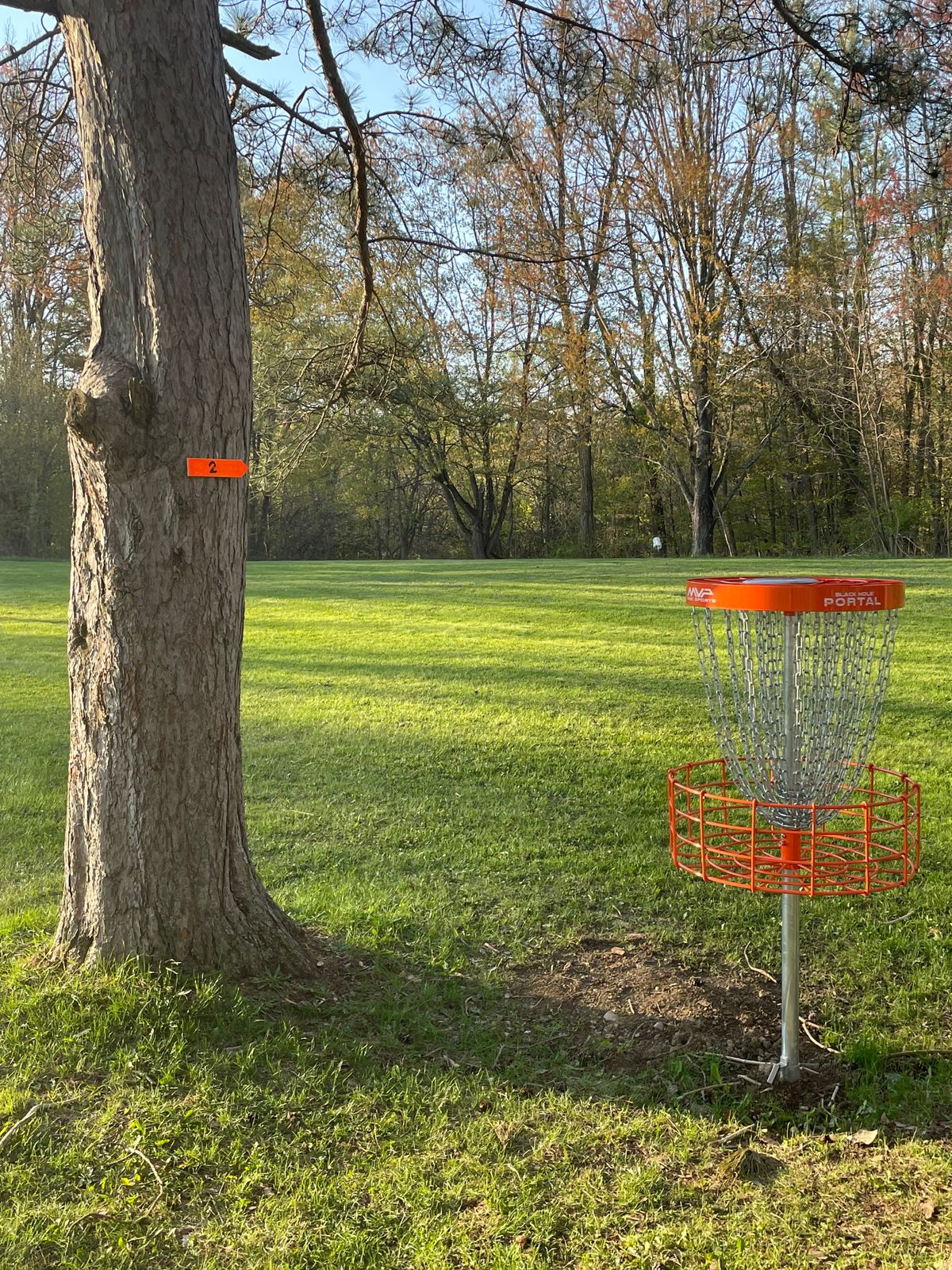Hole 1s basket looking at next Hole 2 tee