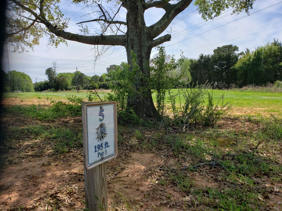 Hole 5. Hole 6 is by the rock pile by the road to the left.