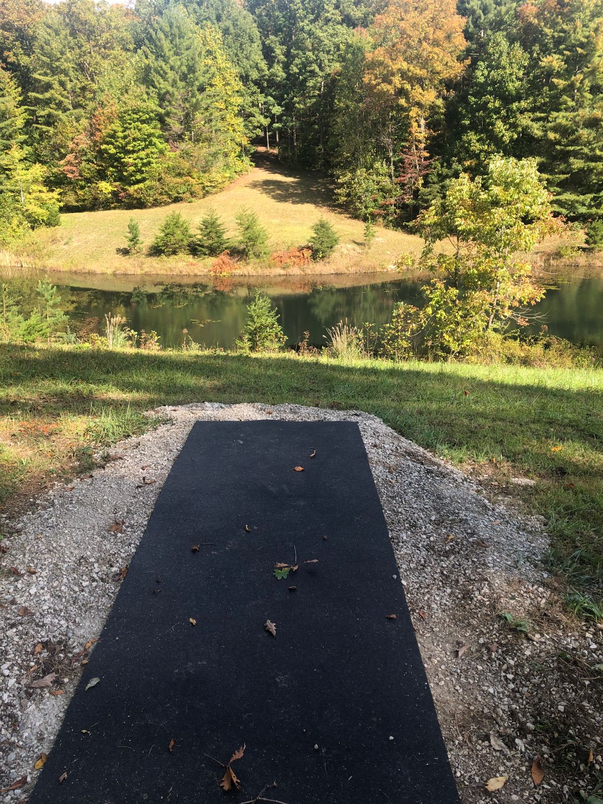 Hole 10 Tee pad. Plays over pond to top of the hill.