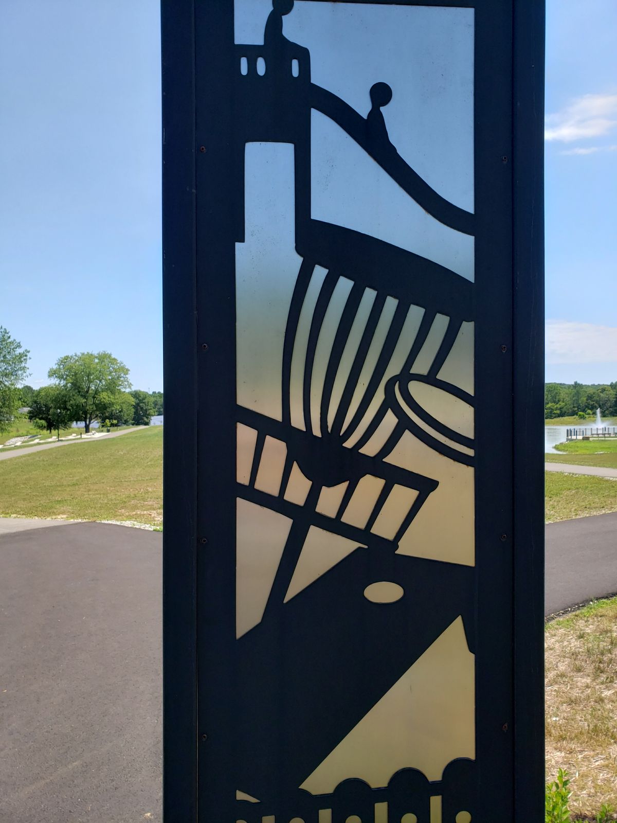 Disc Golf image on main gate entrance arch.