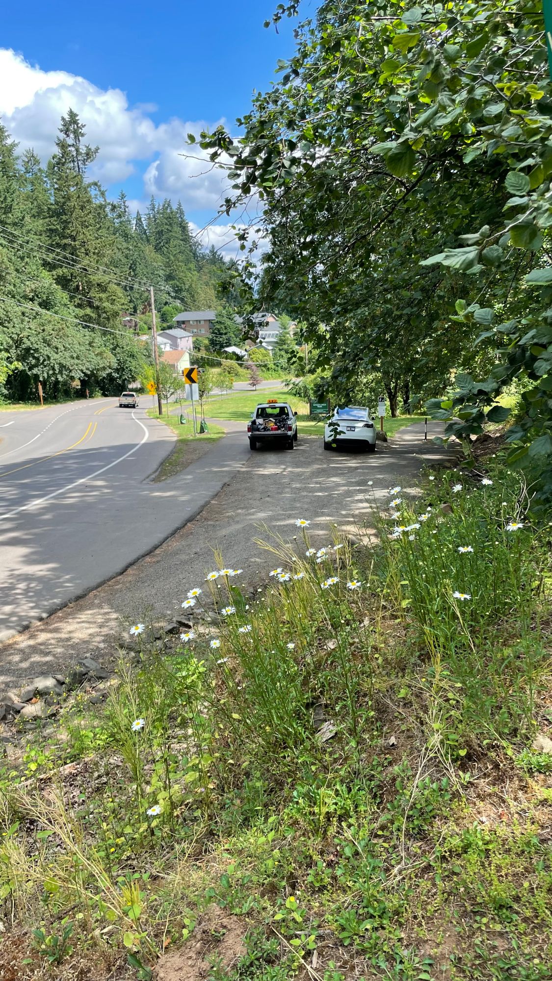 Parking lot from walking trail that leads to holes 1 and 2