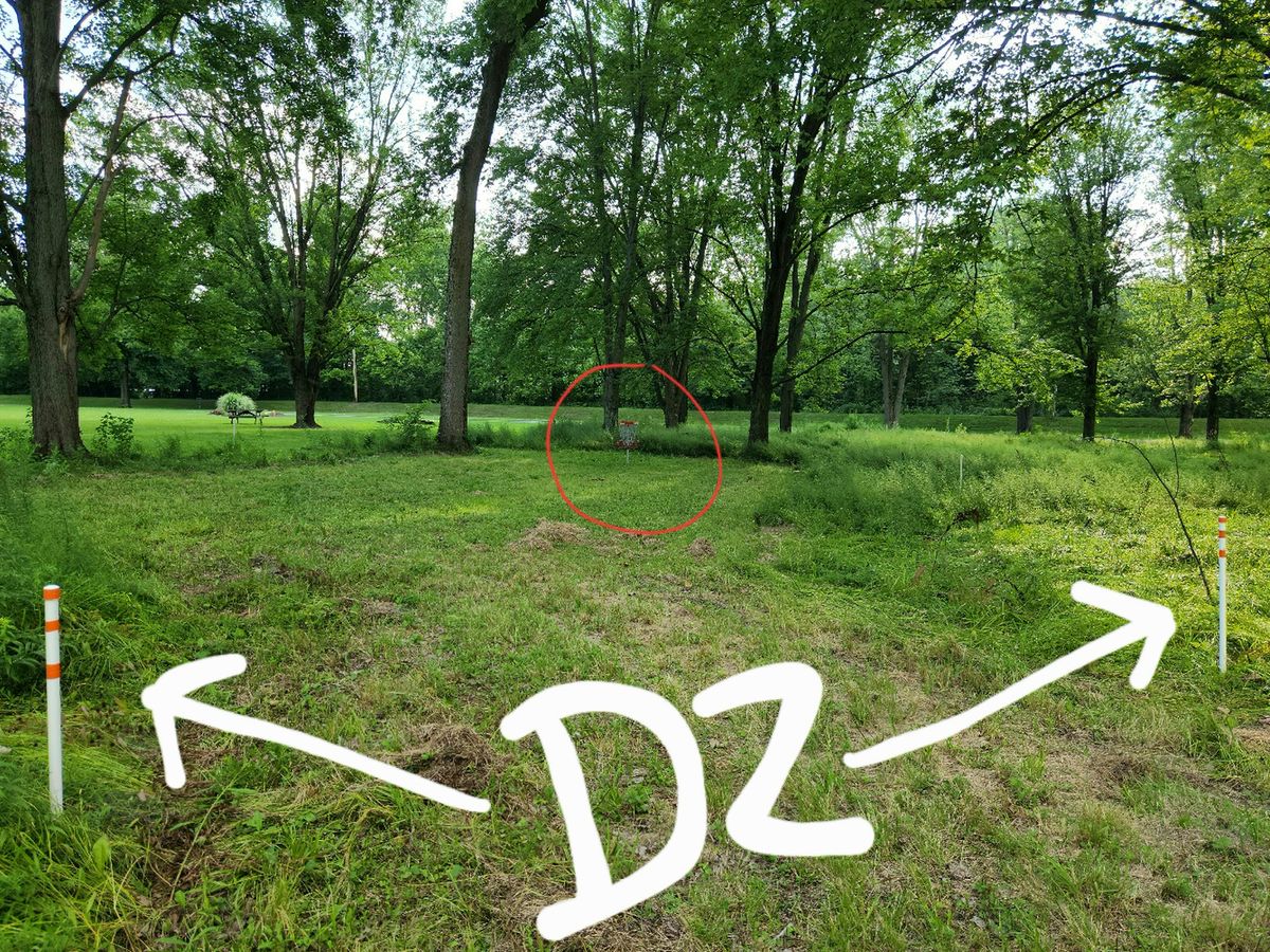 Drop zone on hole 2 indicated by high viz tape on OB stakes