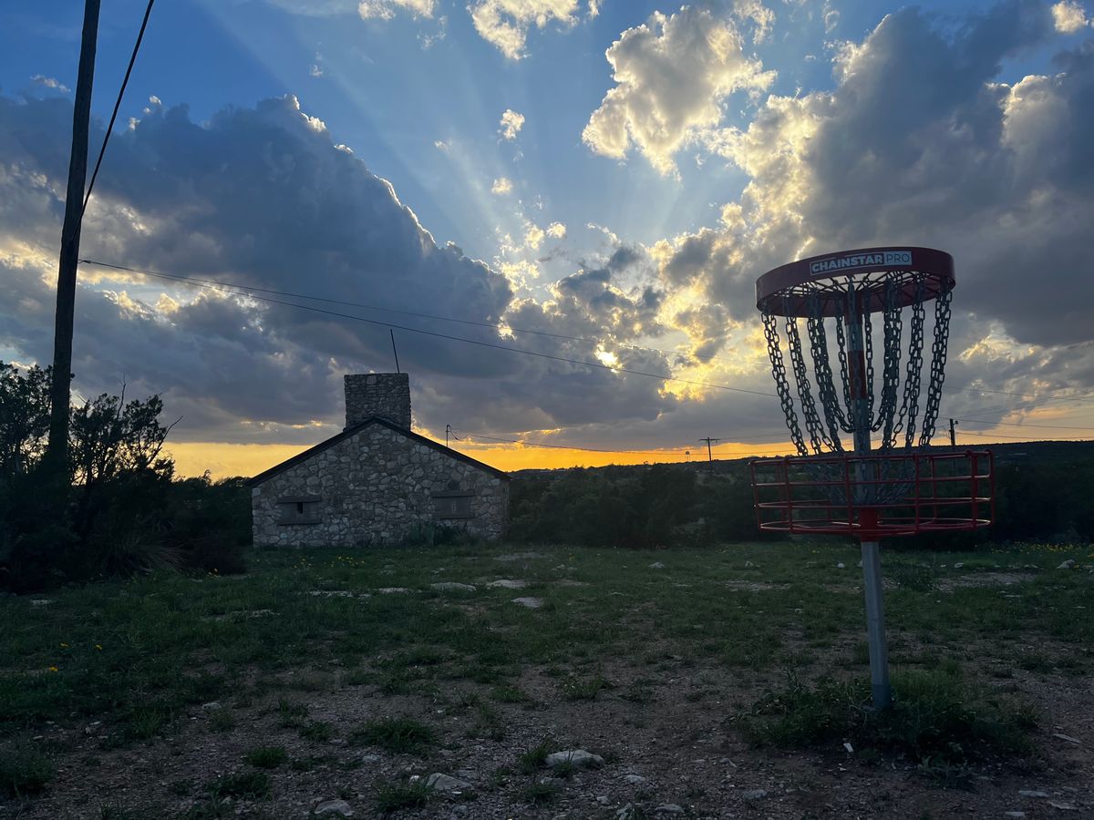 Hole 2 sits left of the old Boy Scouts building from the tee.