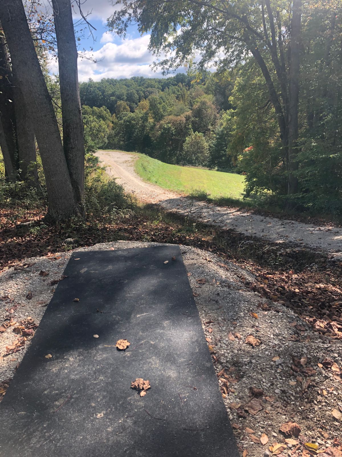 Hole 15’s Tee pad. Plays on other side of the hill tucked in the trees