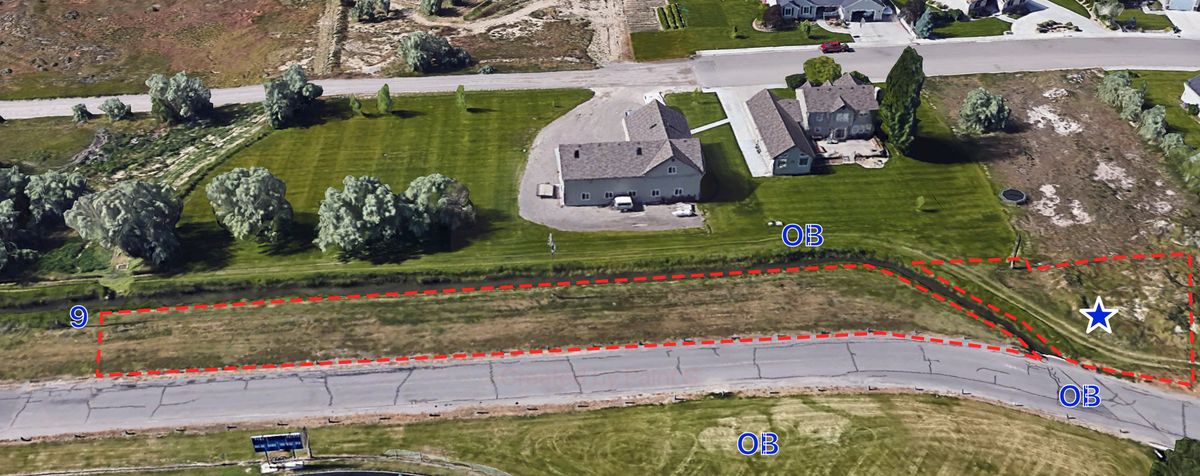 9 we’ll worn dirt tee pad on top of canal ridge next to pole. Ob road and canal