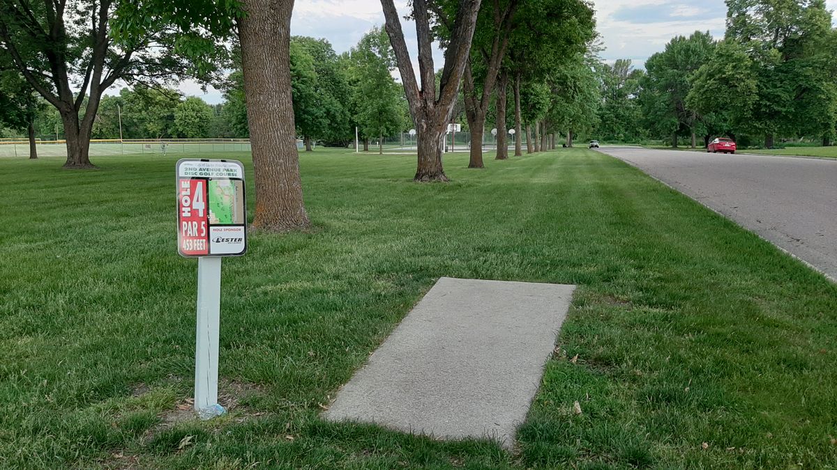 Hole 4 - up along treeline, left past volleyball and basketball courts