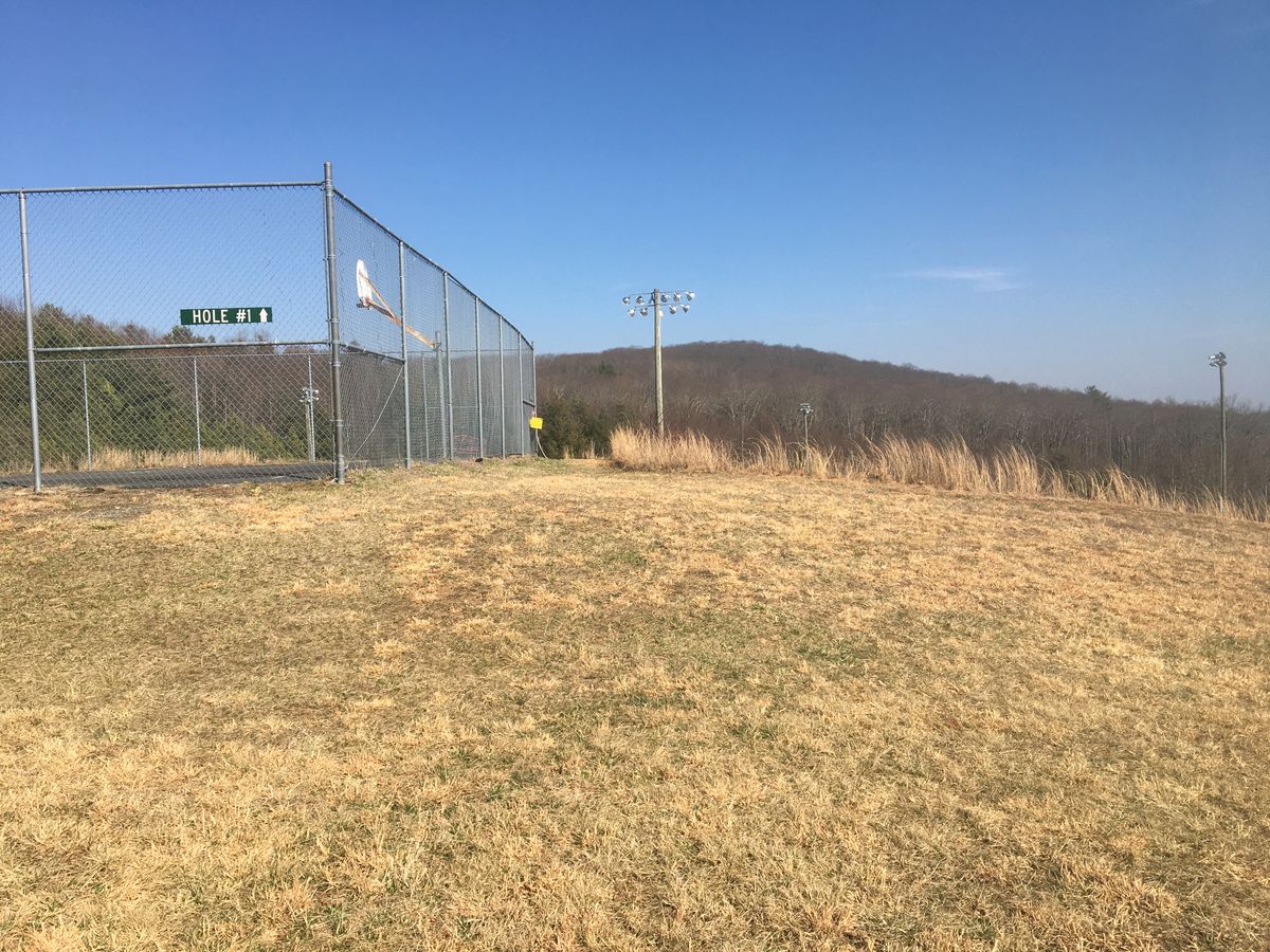 Follow the signs to hole.1 just beyond the basketball court.
