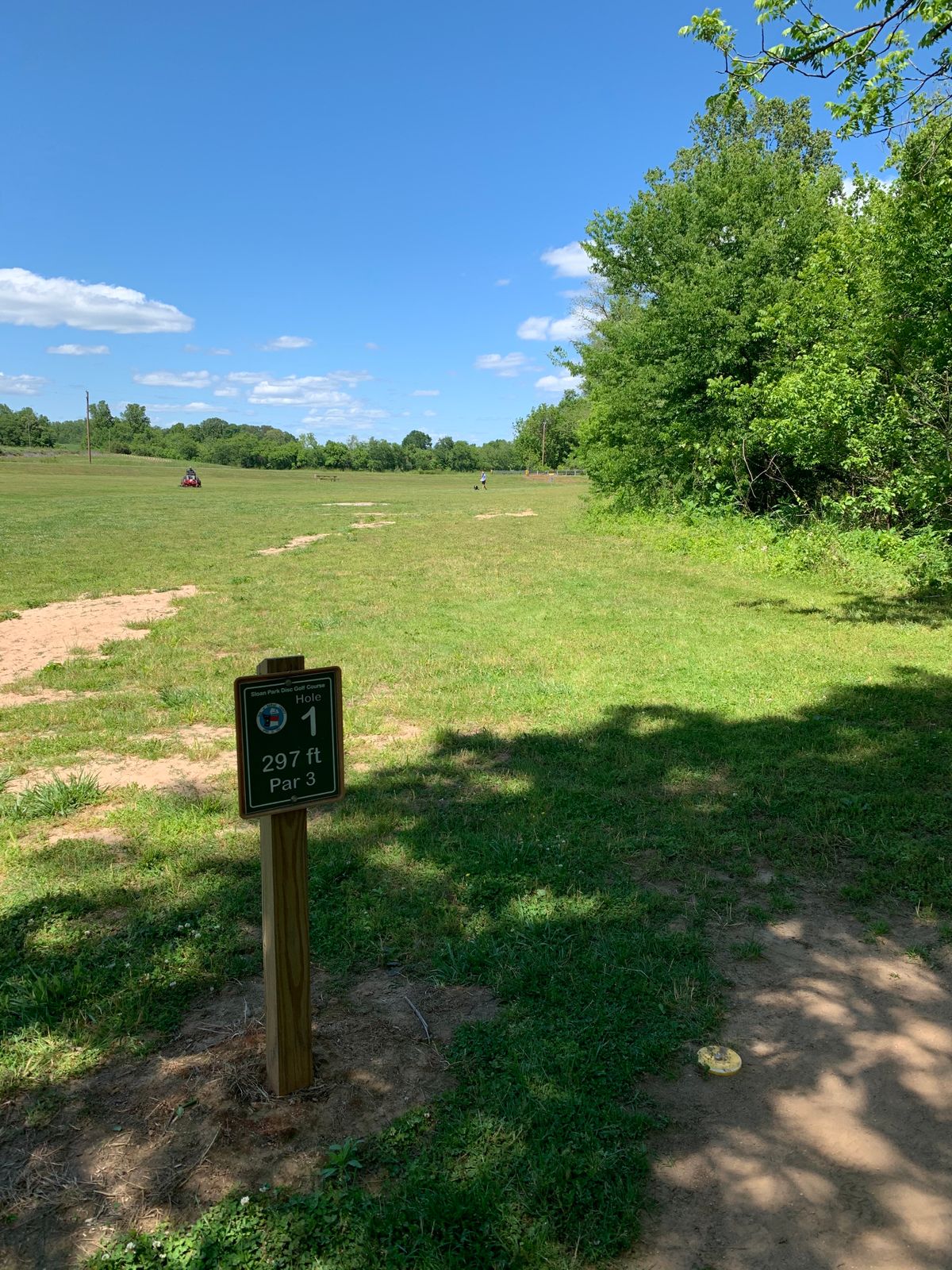 Hole 1 - Creek along the right side with a thin, but dense layer of woods as a buffer.