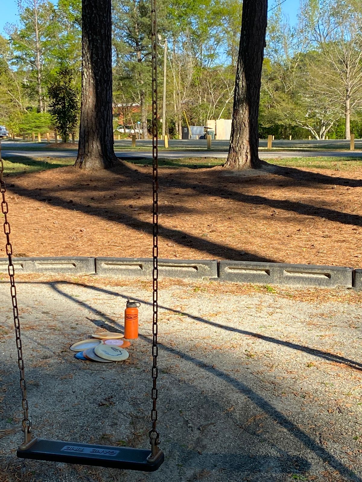 First tee at the swing set.  Double mando through two pines each time you throw from this box.