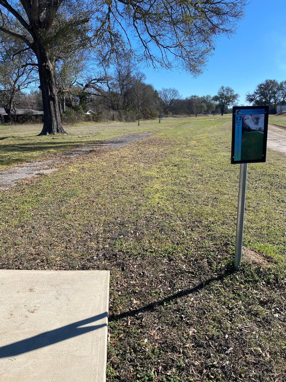 Hole 12, 296ft, OB road, fence and beyond