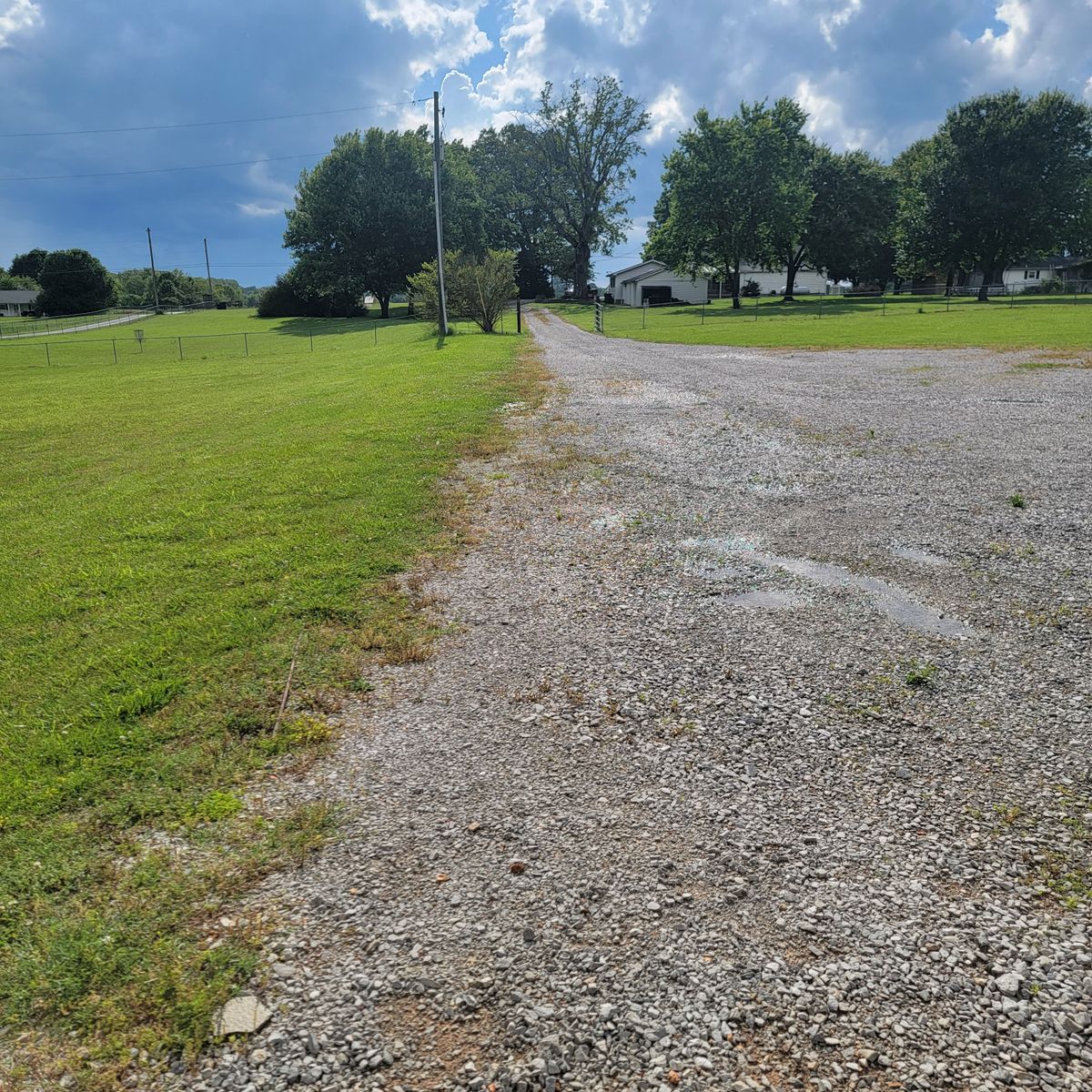 Hole 3 tee pad. Mando right of the telephone pole or over the power lines and you're good. Basket under the 3 trees by the small red building.