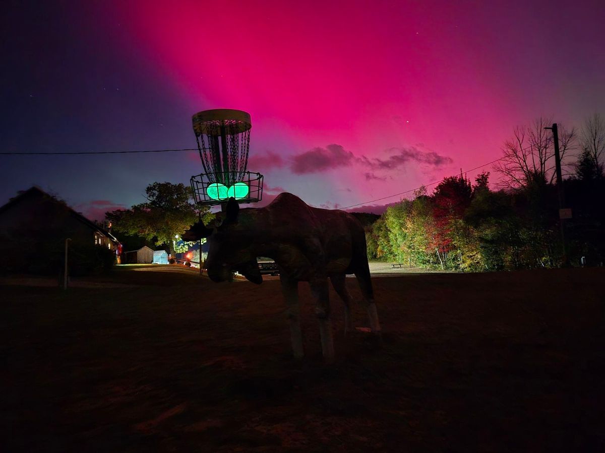 Glow round of disc golf with Aurora on hole 18.