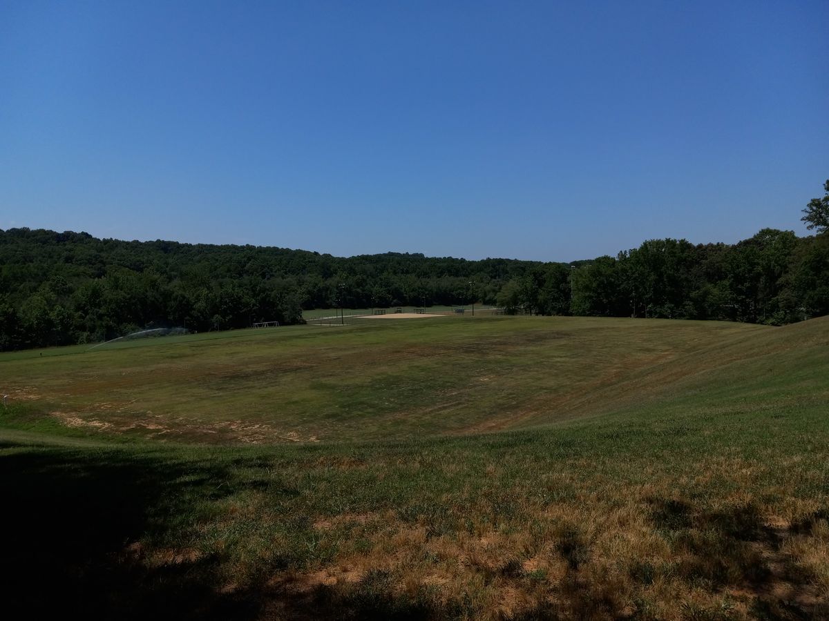 There is a clearing to cut through to the parking lot after finishing hole 18.
