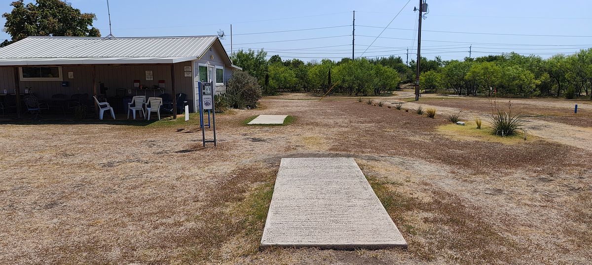 Hole 1 and 9 tee pads, 1 is the pad closer to the basket.