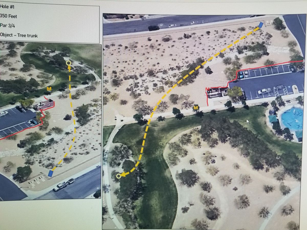 Hole #1 plays from the corner fence line across the dry creek bed and walking path into a grove of trees. There is a mandatory on your left.
