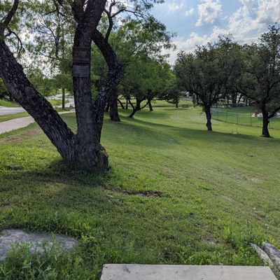 Hole 14 from tee to basket. The dry creek beyond the basket plays as OB in minis and tournaments.