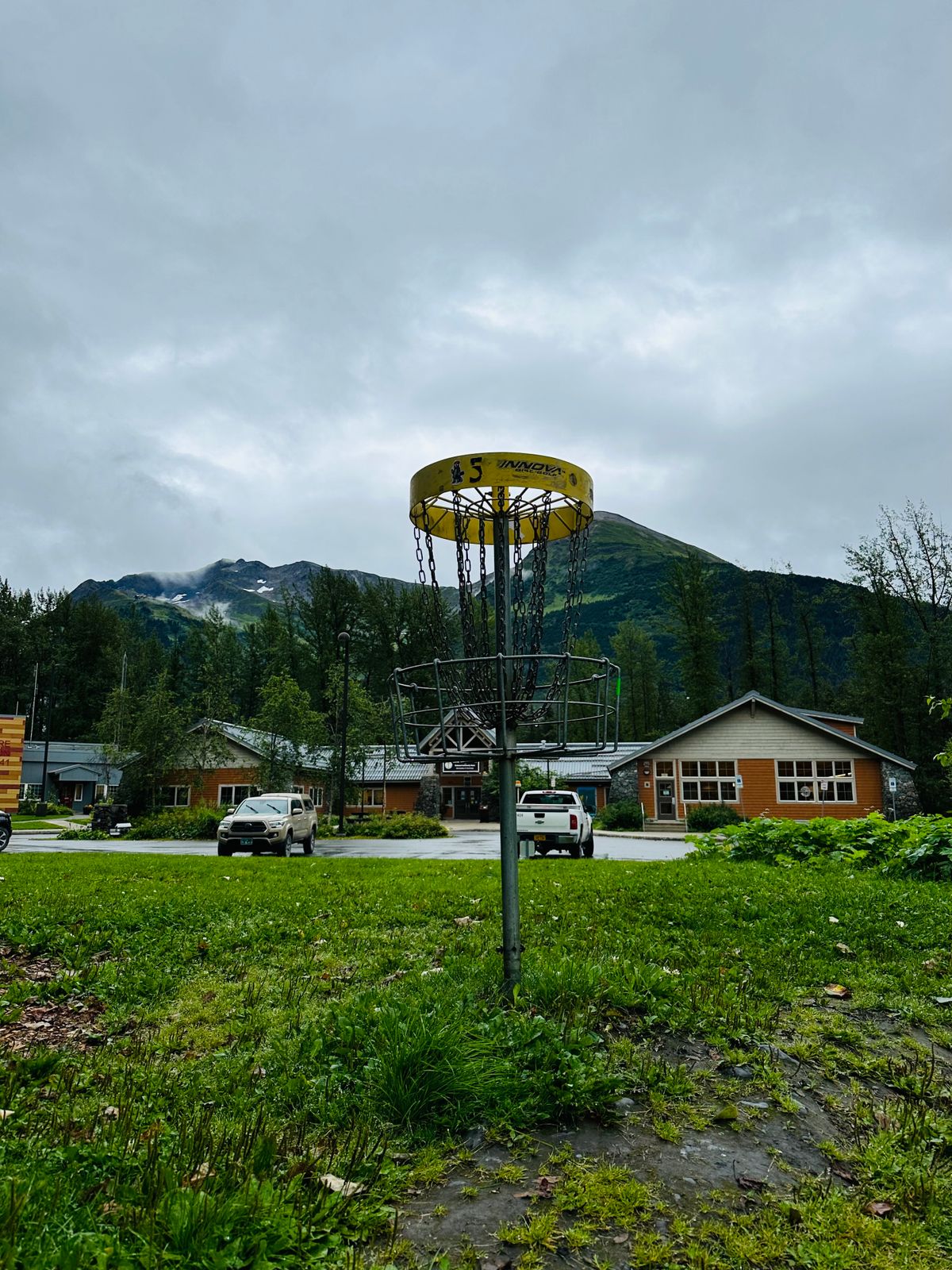 Hole 5’s basket sits with a beautiful view of the local library and the mountains beyond.
