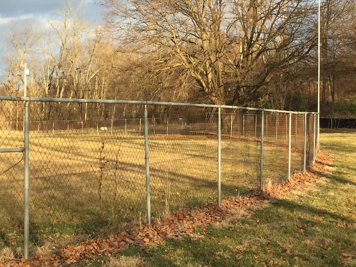 Hole 13 - baseball fence comes into play at tee and at basket