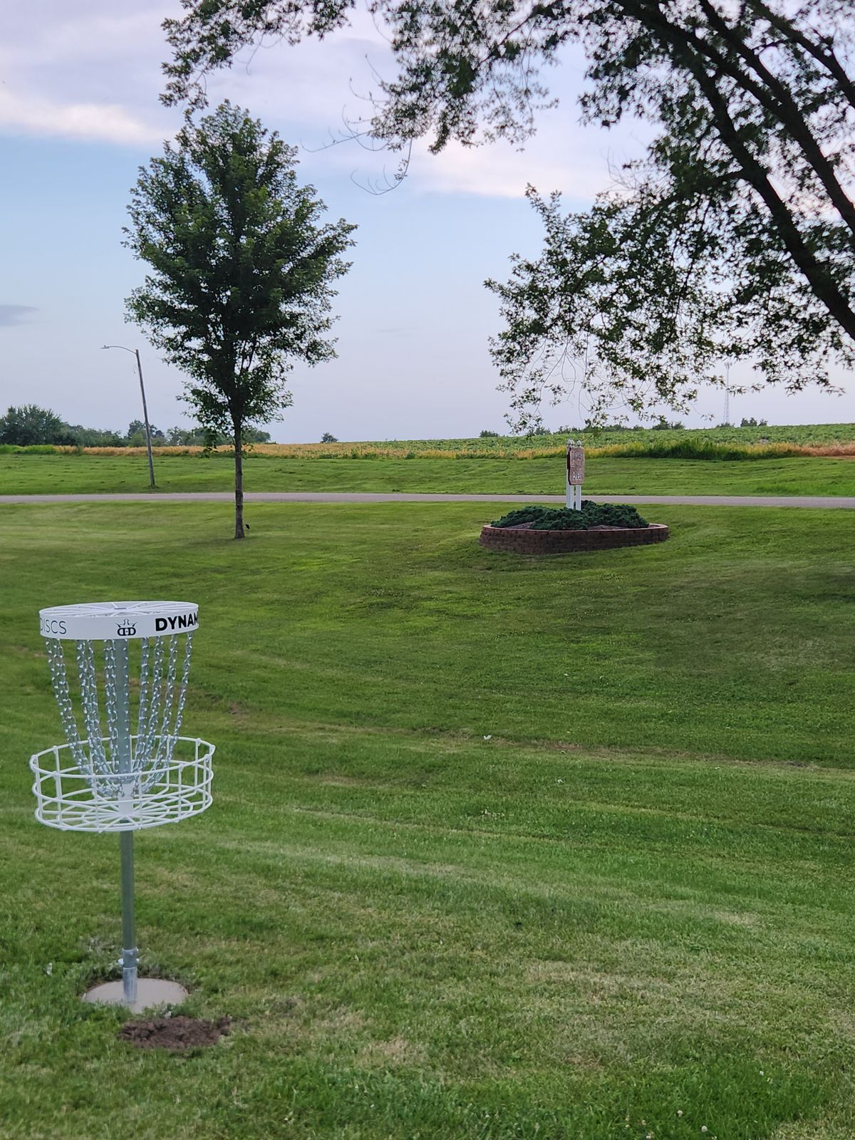 Hole 3s basket by the park sign