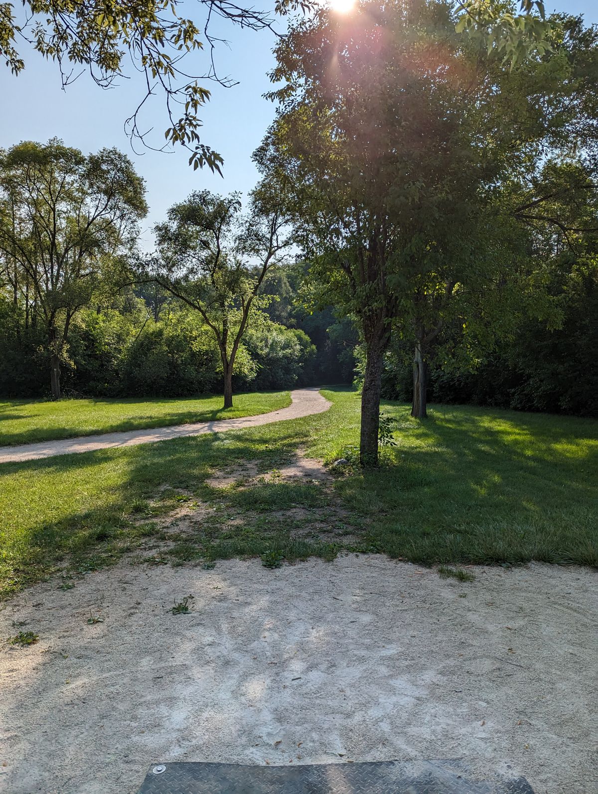 Throwing of the tee along the walking path was not a good layout choice.  Be careful!