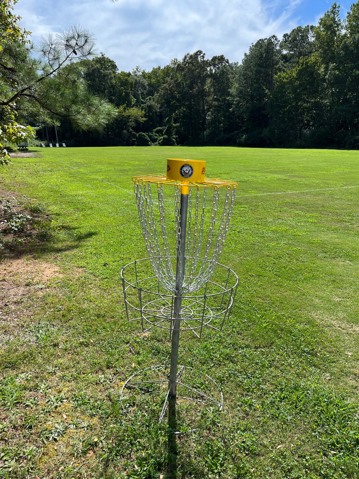 Hole 1 sits on the corner of the band practice field near street.