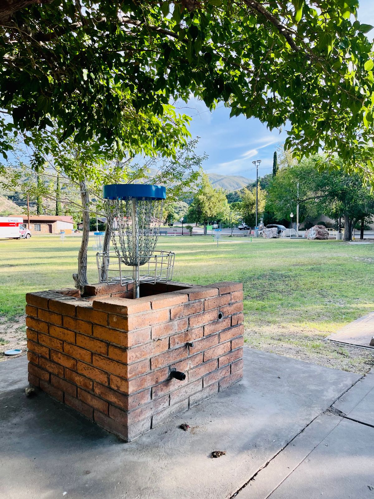 Hole 8 makes use of an old brick planter box. Re-use at its finest