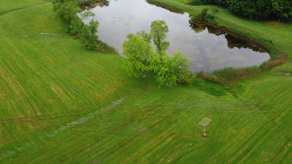 Overhead shot. Right side - 18 white tee to basket. Left side - 9 basket.